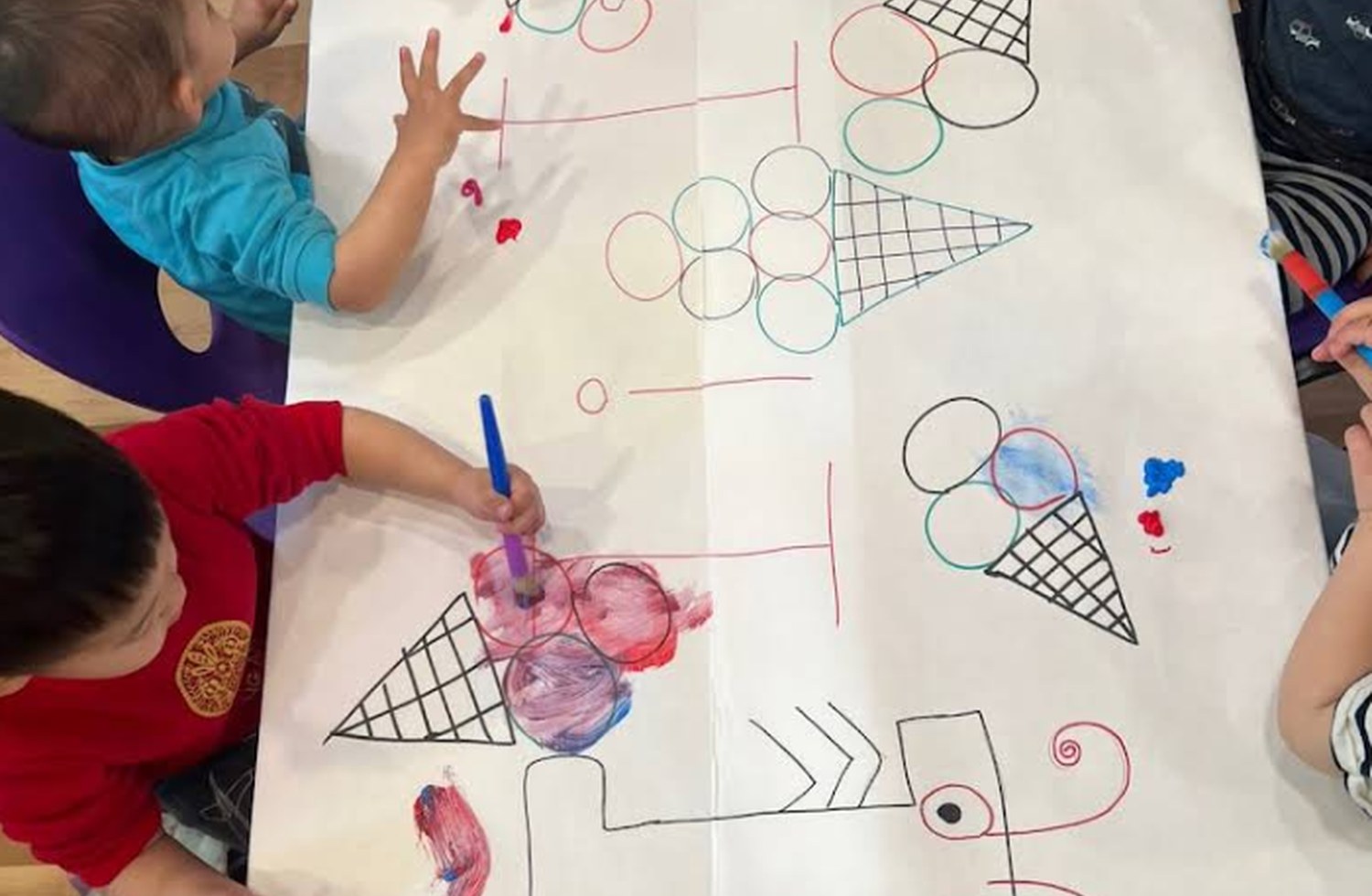 Children working on a group art activity